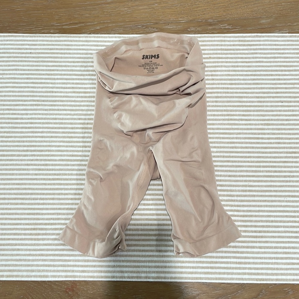 SKIMS Maternity sculpting short mid-thigh.